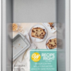 Retail-packaged Wilton Recipe Right medium loaf pan with label and baked goods on packaging.